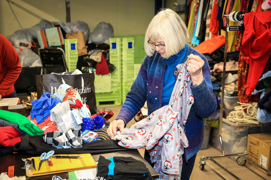 Volunteer sorting clothing